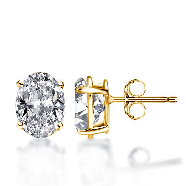 Pair of Studs With 2.0 Ct. OVAL Shaped Diamonds Set In A Classic Four Prong Basket