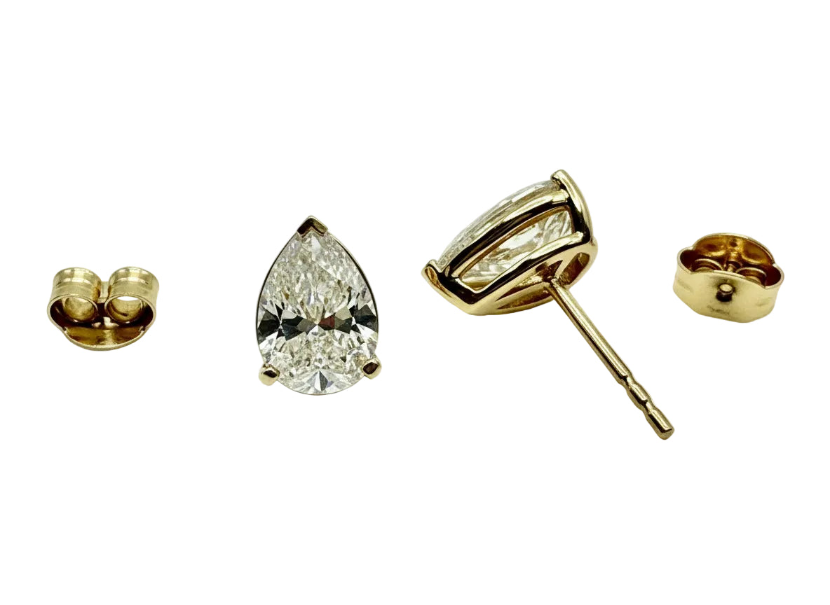 Pair of Studs With 4.0 Ct. PEAR Shaped Solitaire Diamonds Set In A Classic Three Prong Basket