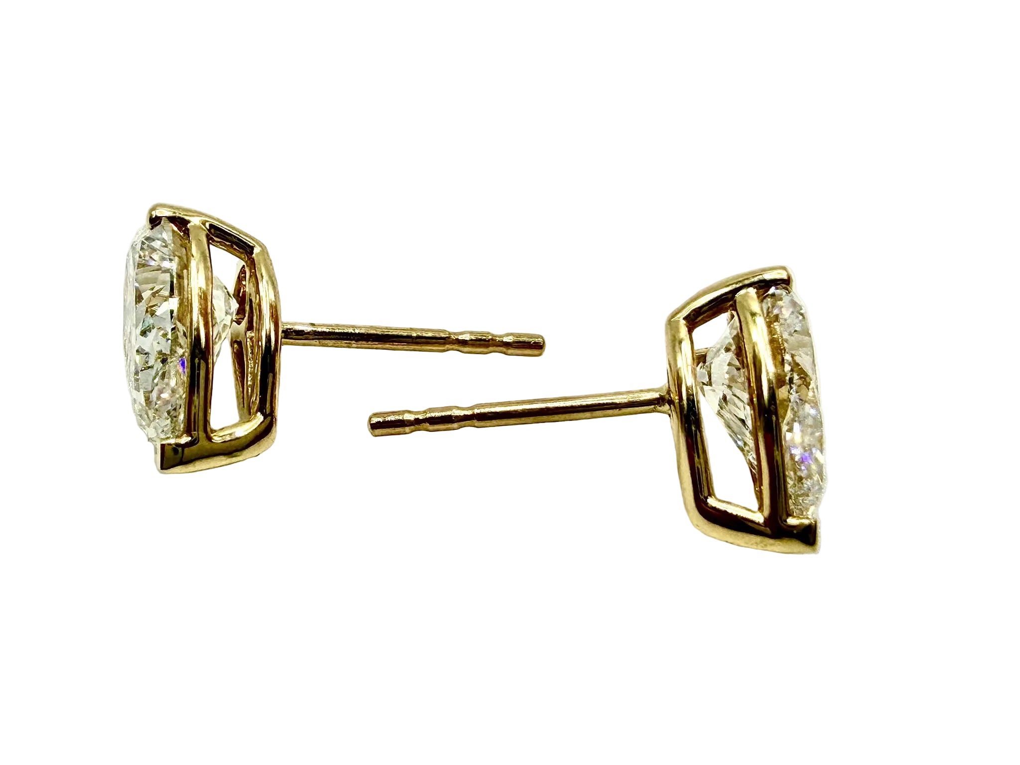 Pair of Studs With 4.0 Ct. PEAR Shaped Solitaire Diamonds Set In A Classic Three Prong Basket