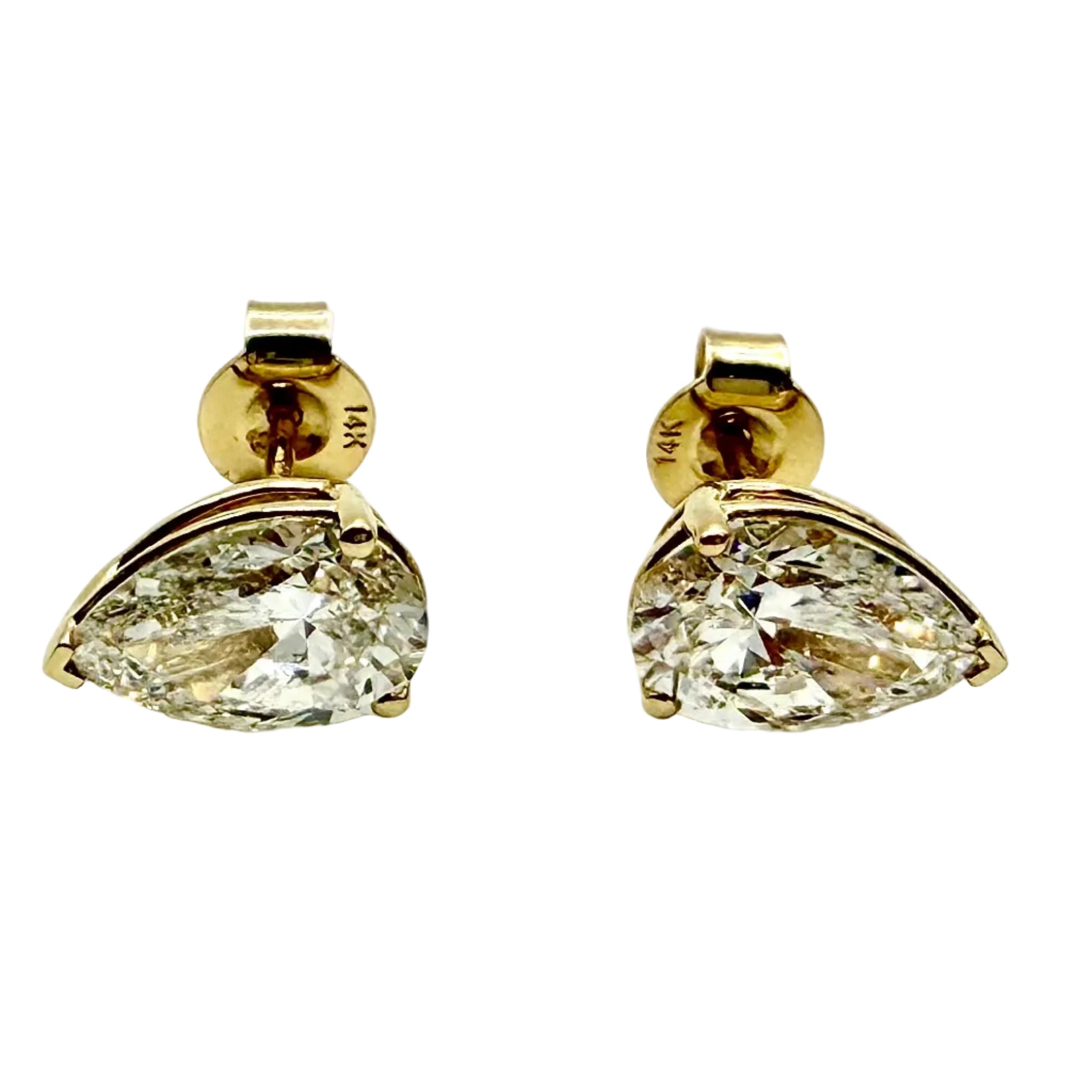 Pair of Studs With 4.0 Ct. PEAR Shaped Solitaire Diamonds Set In A Classic Three Prong Basket