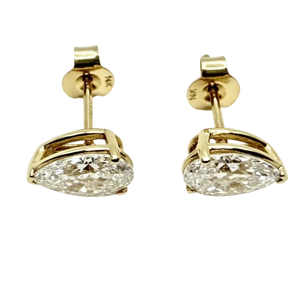 Pair of Studs With 4.0 Ct. PEAR Shaped Solitaire Diamonds Set In A Classic Three Prong Basket