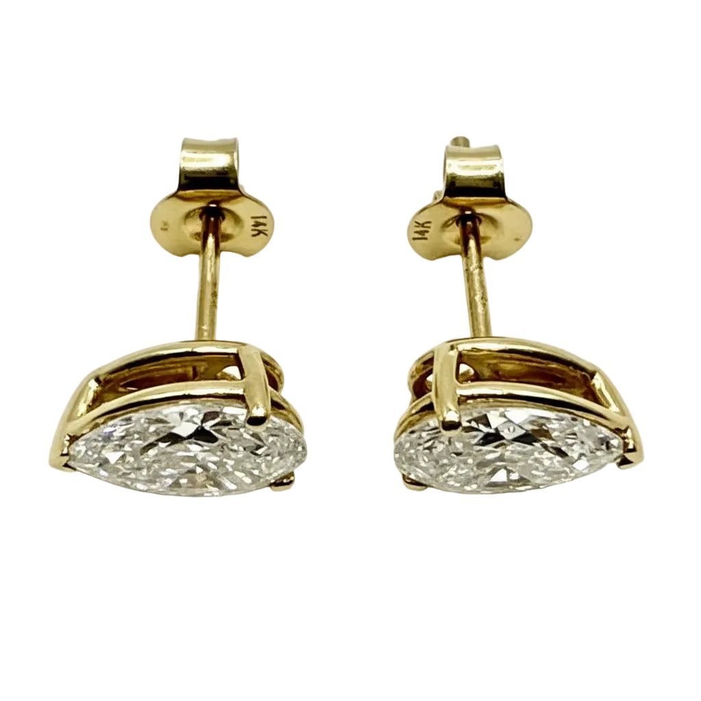 Pair of Studs With 4.0 Ct. PEAR Shaped Solitaire Diamonds Set In A Classic Three Prong Basket