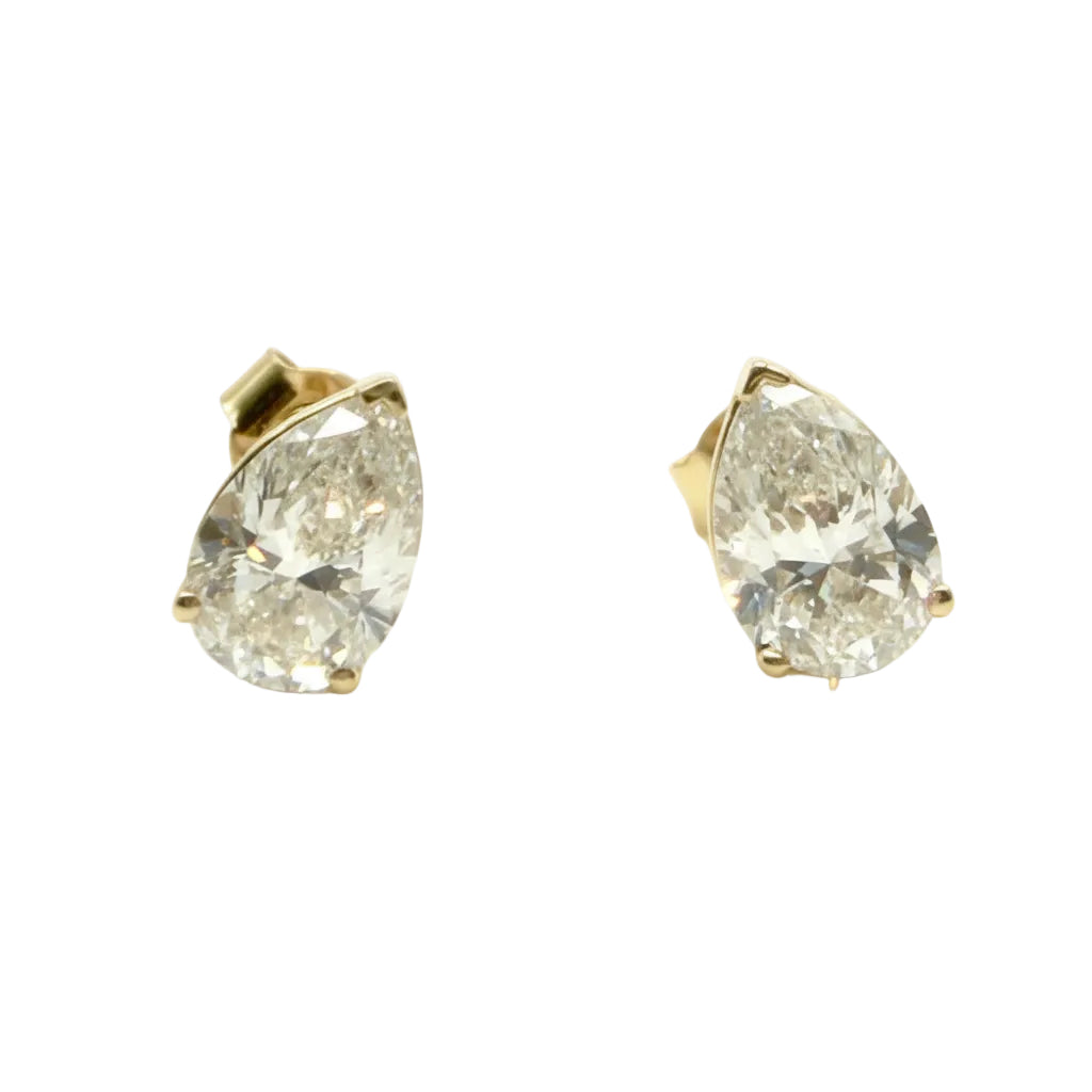 Pair of Studs With 4.0 Ct. PEAR Shaped Solitaire Diamonds Set In A Classic Three Prong Basket