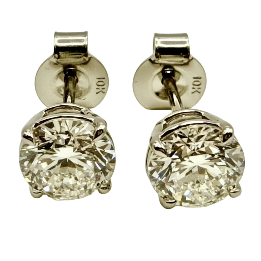 Pair of Studs With 1.0 Ct. ROUND Cut Solitaire Diamonds Set In A Classic Four Prong Basket Setting