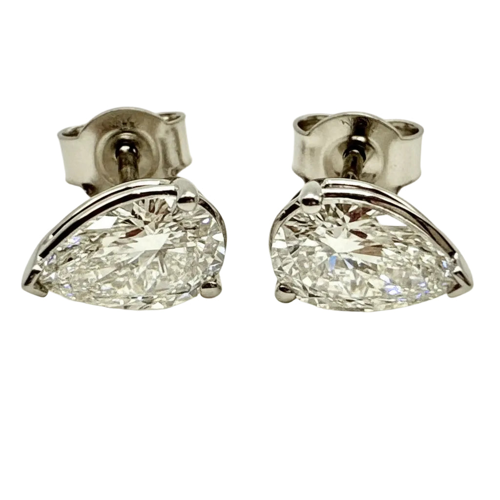 Pair of Studs With 2.0 Ct. PEAR Shaped Solitaire Diamonds Set In A Classic Three Prong Basket Setting