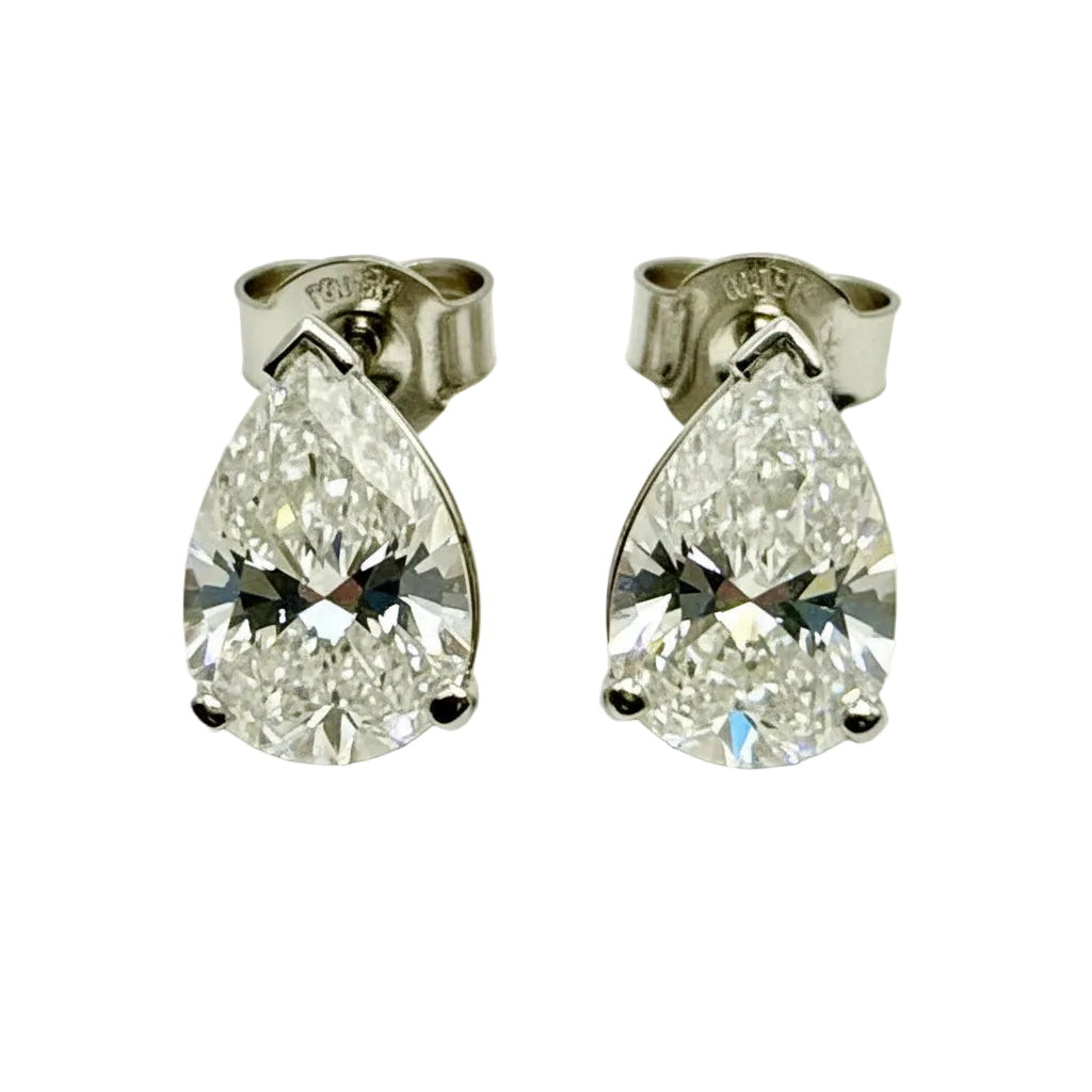 Pair of Studs With 2.0 Ct. PEAR Shaped Solitaire Diamonds Set In A Classic Three Prong Basket Setting