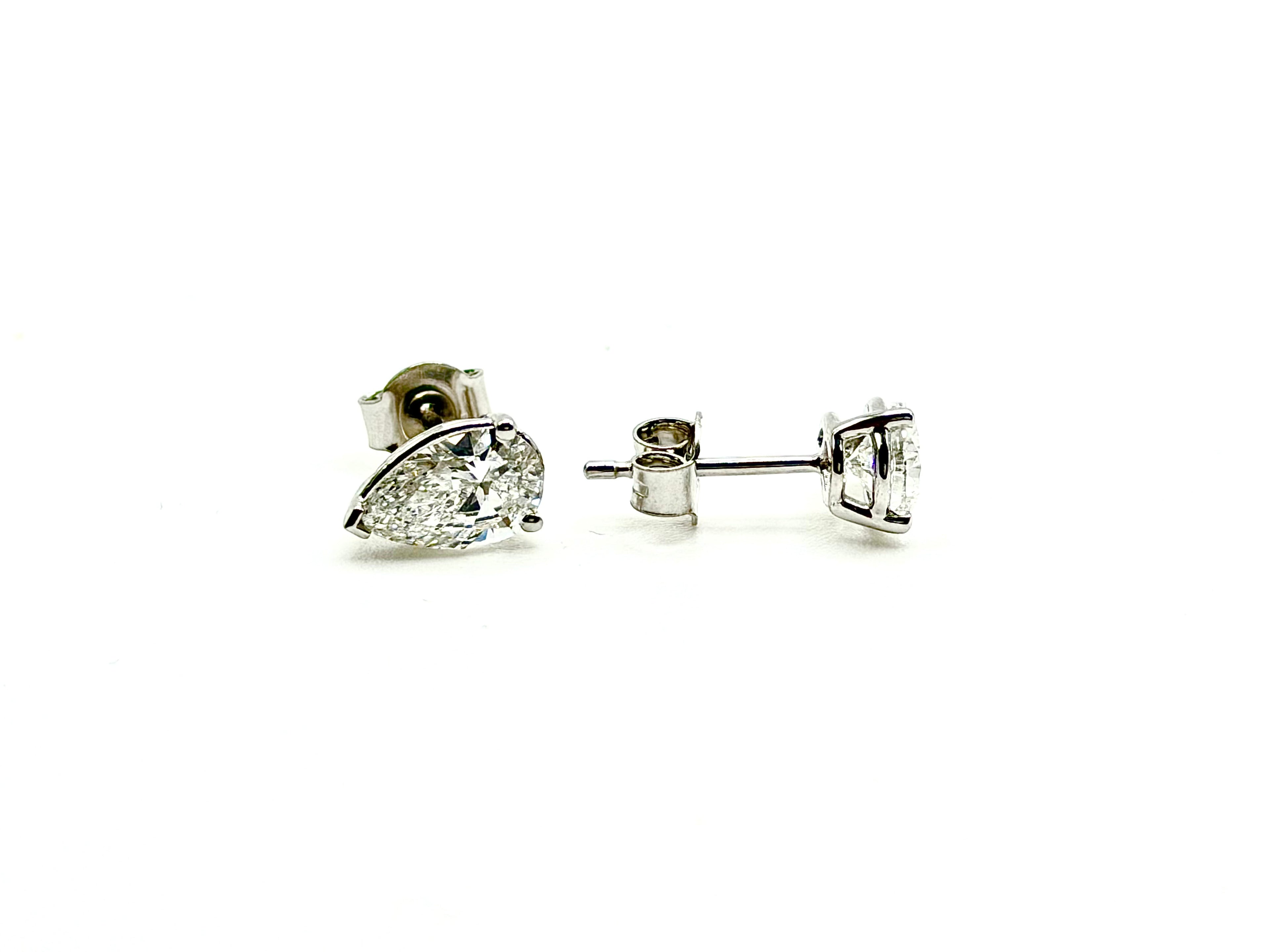 Pair of Studs With 0.50 Ct. PEAR Shaped Excellent Cut Stones Set In A Classic Three Prong Basket