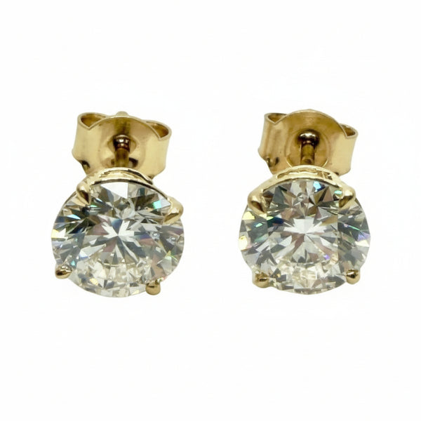 Pair of Studs With 4 Ct. ROUND Cut Solitaire Diamonds Secured In Classic Four Prong Basket
