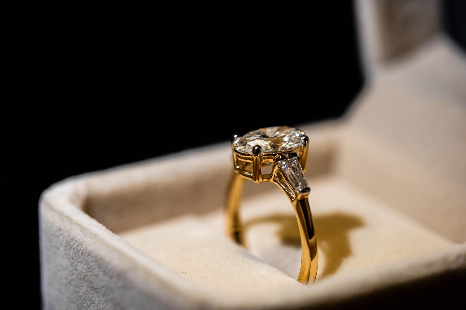 2.4 Ct. OVAL Shaped Classic Trilogy Ring With Tapered Baguettes On Sides