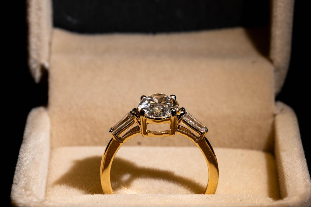 2.4 Ct. OVAL Shaped Classic Trilogy Ring With Tapered Baguettes On Sides