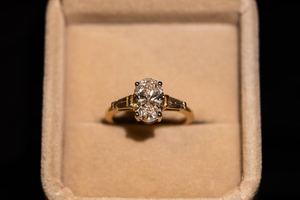 2.4 Ct. OVAL Shaped Classic Trilogy Ring With Tapered Baguettes On Sides