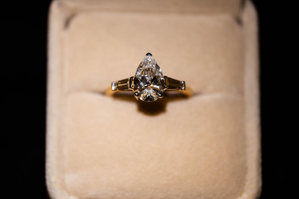 1.9 Ct. PEAR Shaped Classy Diamond Ring With Tapered Baguettes On Sides