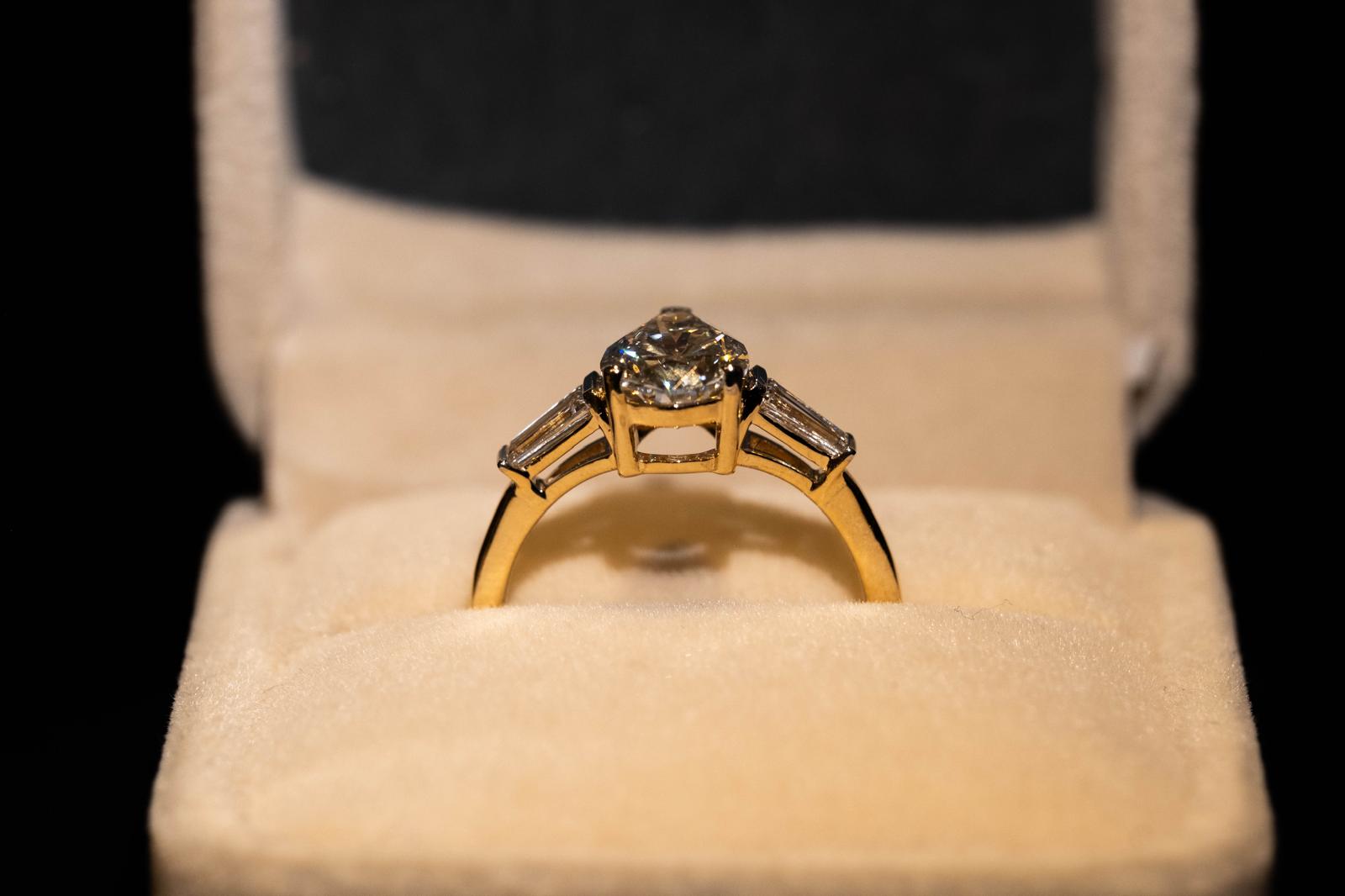 1.9 Ct. PEAR Shaped Classy Diamond Ring With Tapered Baguettes On Sides