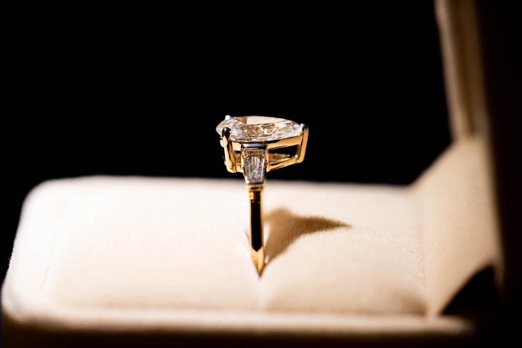 1.9 Ct. PEAR Shaped Classy Diamond Ring With Tapered Baguettes On Sides