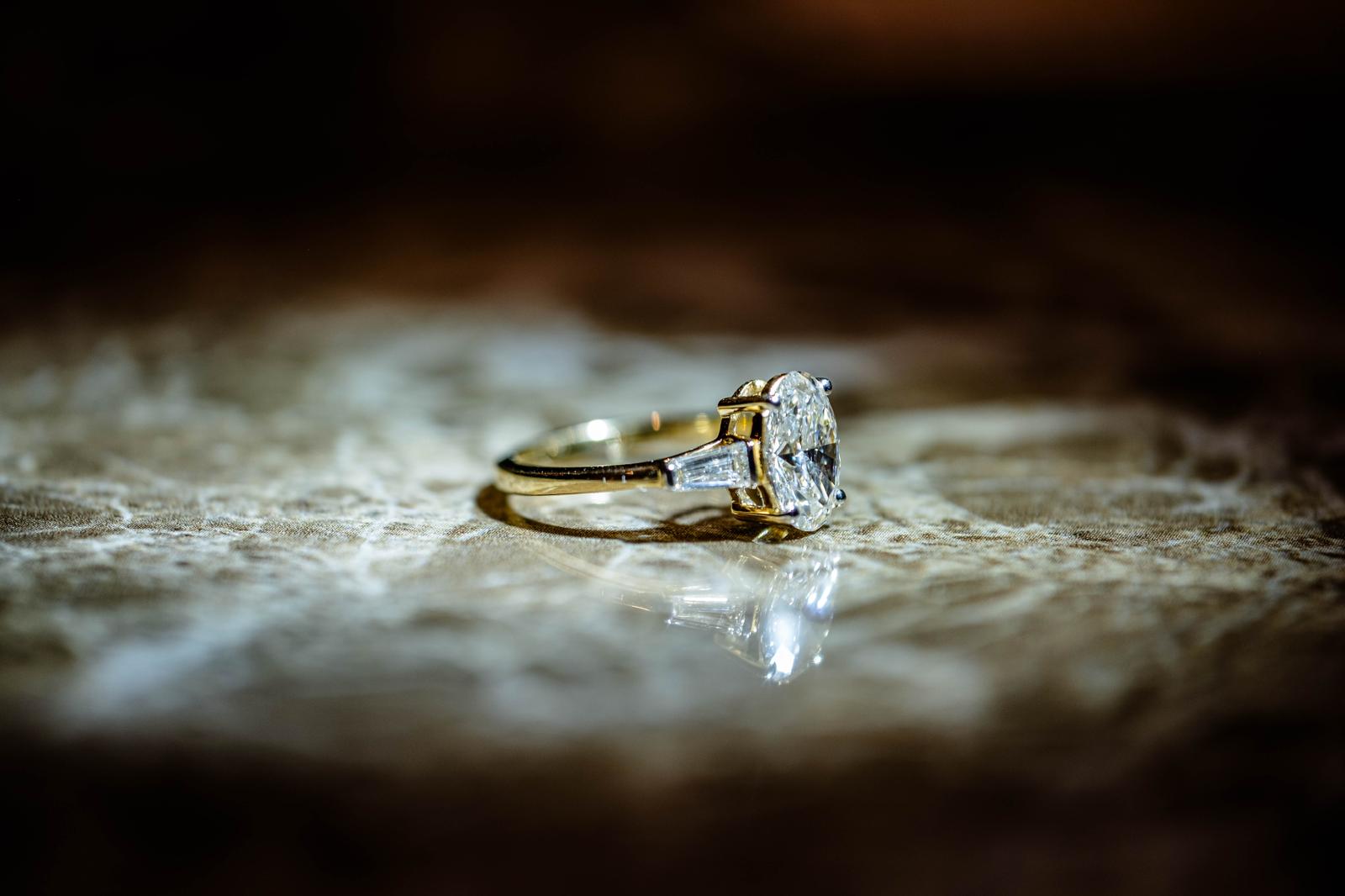 1.9 Ct. OVAL Shaped Classic Trilogy Ring With Tapered Baguettes On Sides