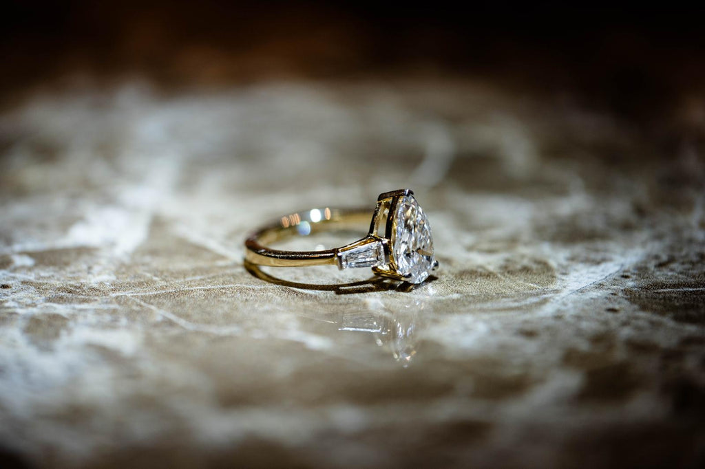 1.9 Ct. PEAR Shaped Classy Diamond Ring With Tapered Baguettes On Sides